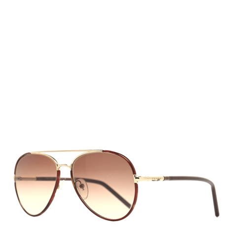 prada aluminum sunglasses with holes|PRADA Metal Aviator Sunglasses SPR66X Brown .